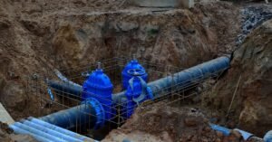 Rhino Rooter works on sewer repair with safe, modern pipelines at an active construction site.